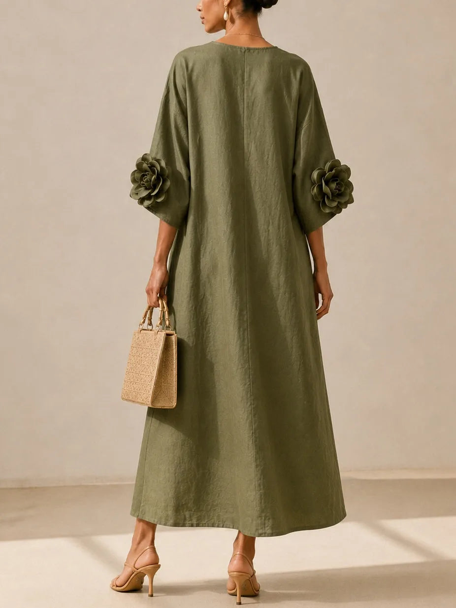 Women's olive green midi dress with floral appliqué sleeves, back view
