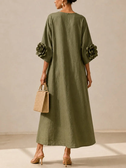 Women's olive green midi dress with floral appliqué sleeves, back view