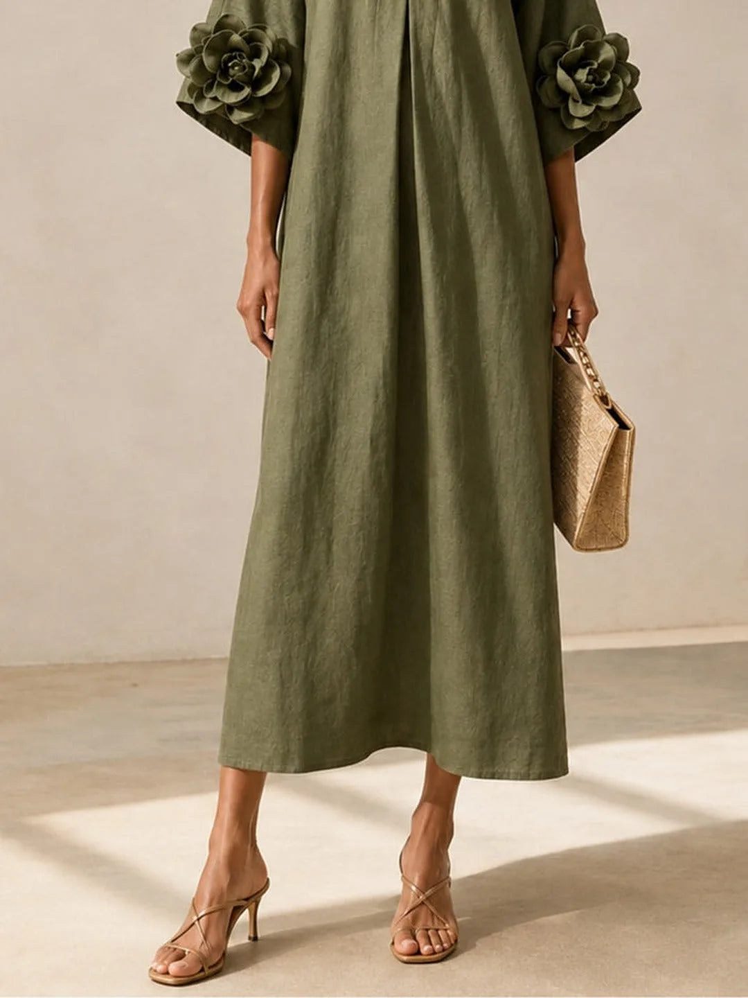 Women's olive green midi dress with floral appliqué sleeves, full-length back view