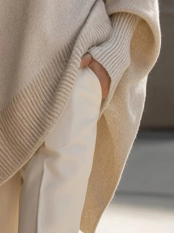 Women's oversized batwing sweater with side slits, cream, close-up of the ribbed cuff