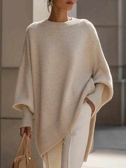 Women's oversized batwing sweater with side slits, peach, front view with tote bag
