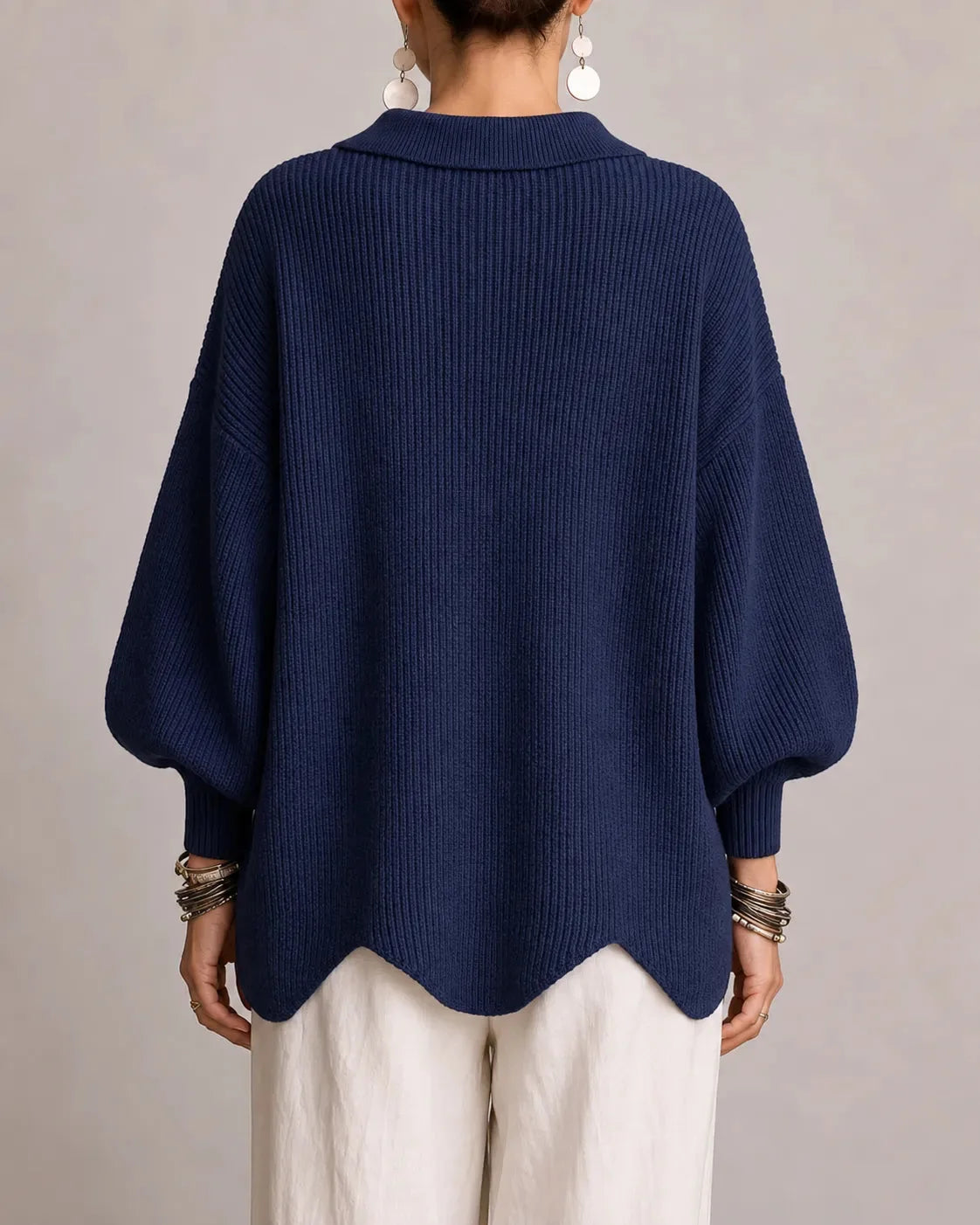 Women's oversized button-front cardigan with gold buttons, back view
