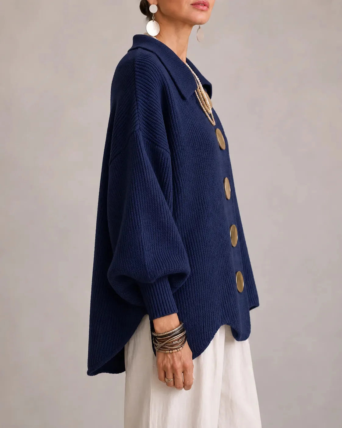Women's oversized button-front cardigan with gold buttons, side view