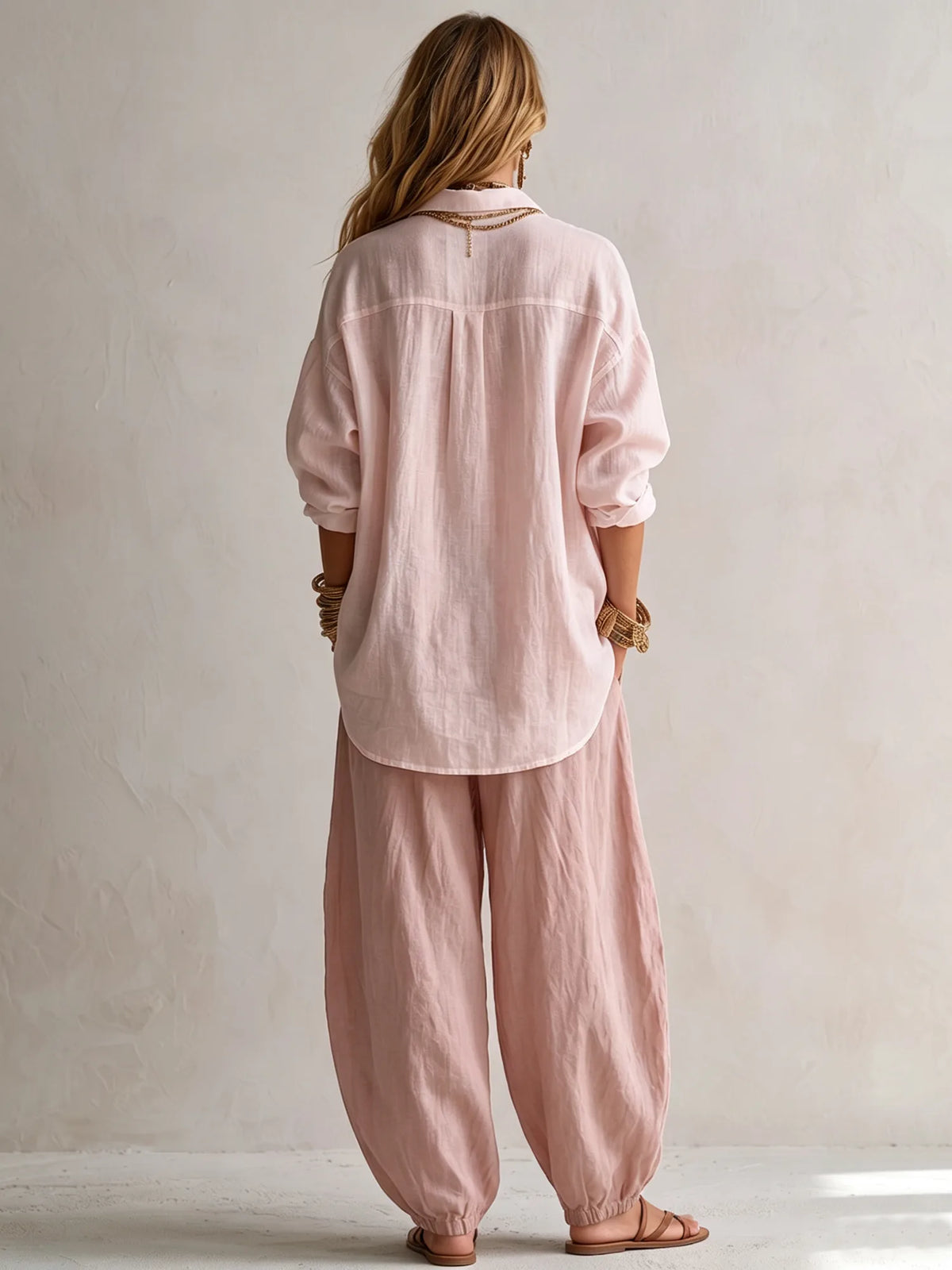 Women's pink relaxed shirt and lantern pants set, back view