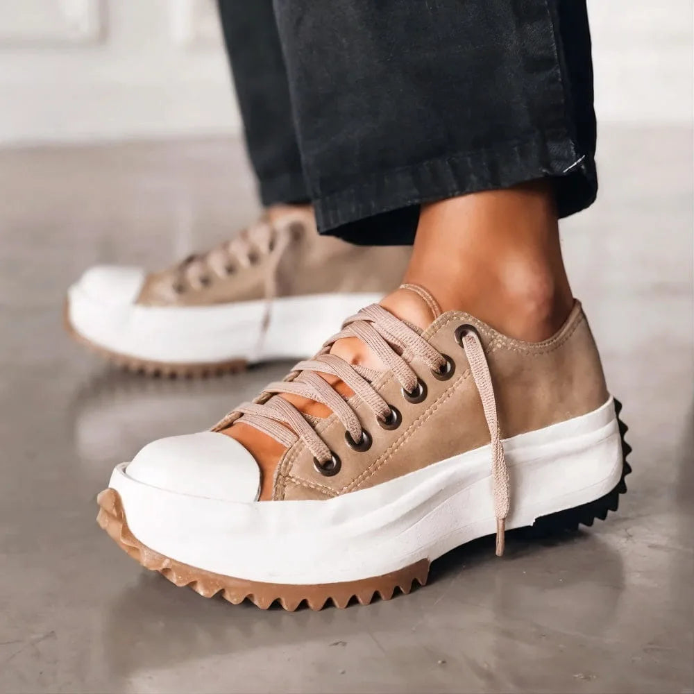 Women's platform sneakers with cushioned sole, brown, worn with jeans