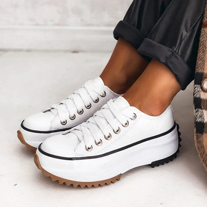 Women's platform sneakers with cushioned sole, white, worn with jeans