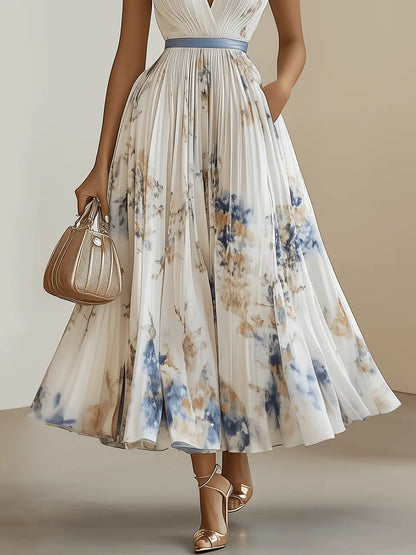 Women's pleated floral V-neck maxi dress, white, close-up of the pleated floral skirt