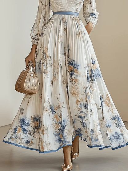 Women's pleated floral V-neck maxi dress with balloon sleeves, white, close-up of the floral hem