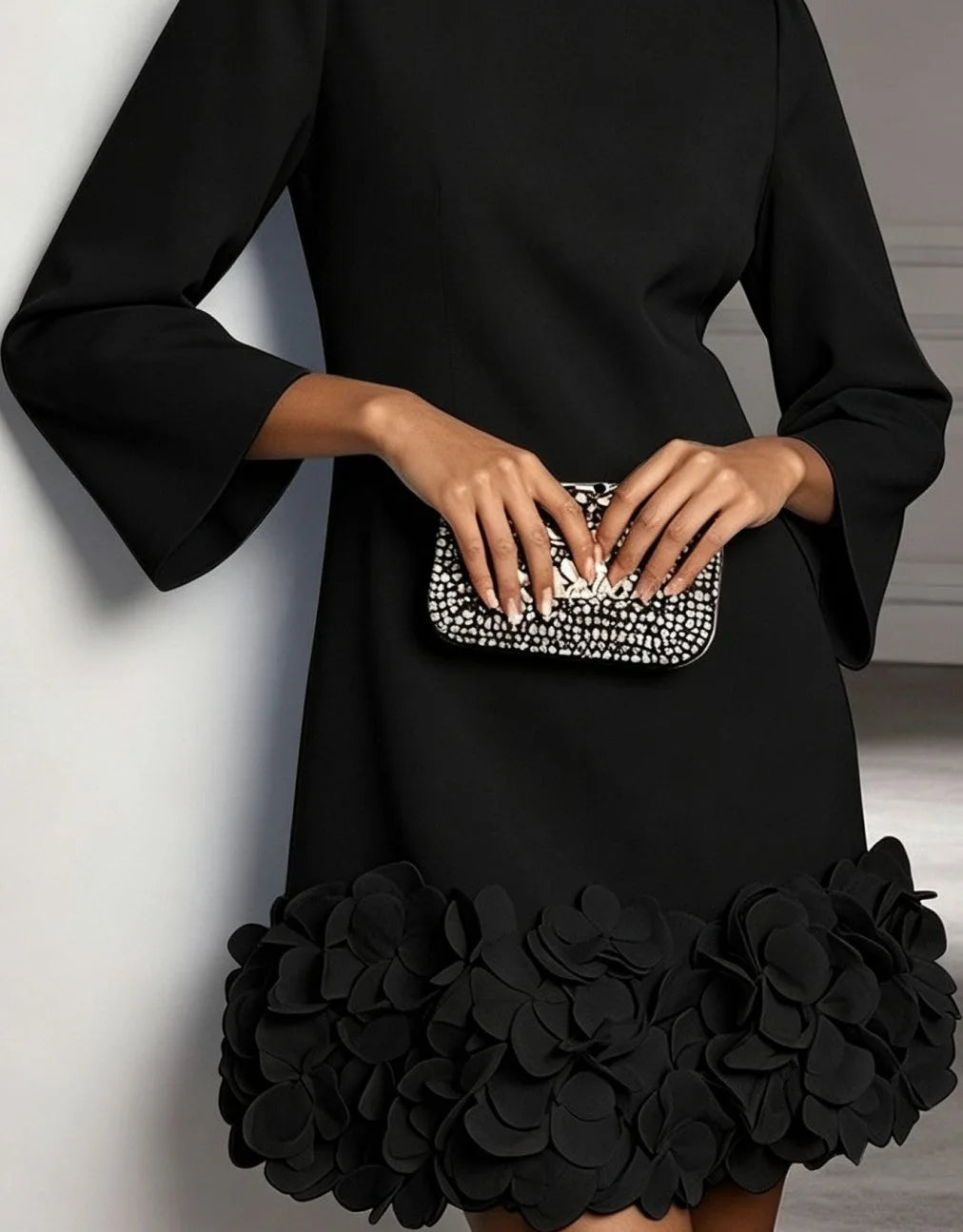 Women's round-neck shift mini dress with 3D floral hem, black, close-up of the 3D floral hem