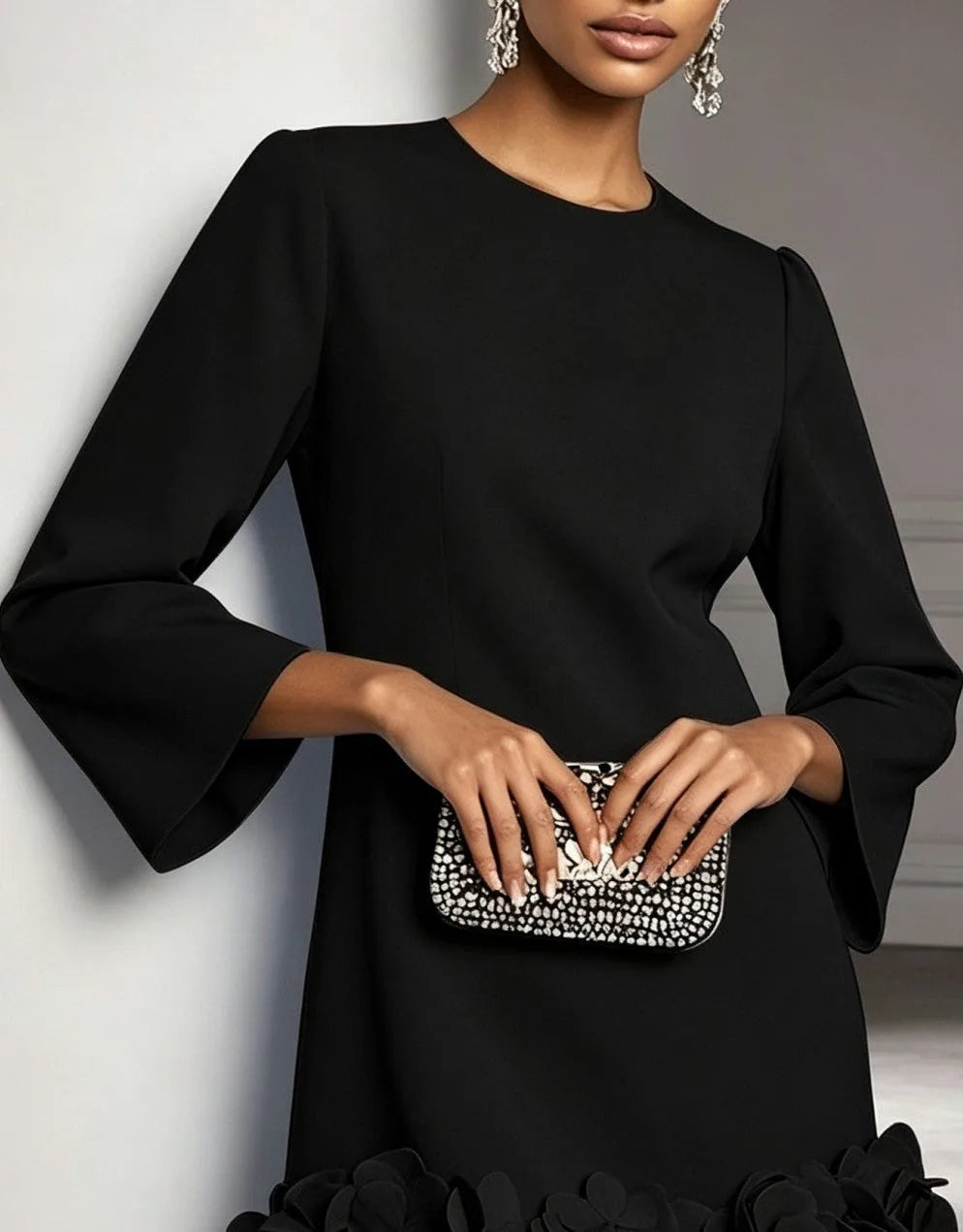 Women's round-neck shift mini dress with 3D floral hem, black, close-up of the neckline and sleeves
