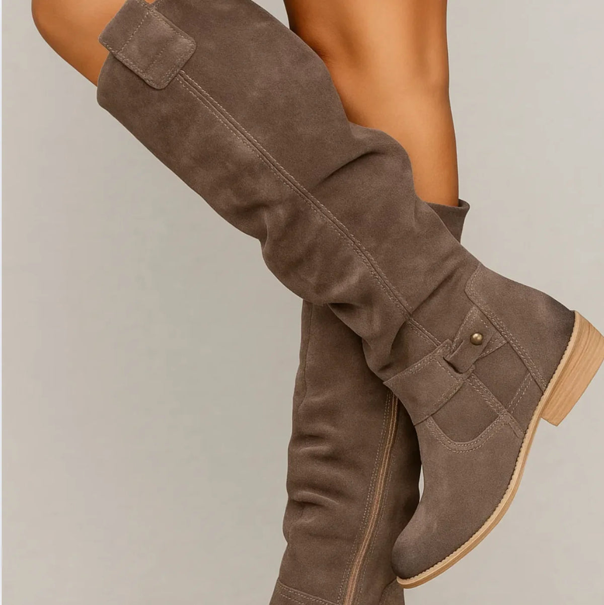 Women's slouchy knee-high boots with buckle strap, grey, side view worn