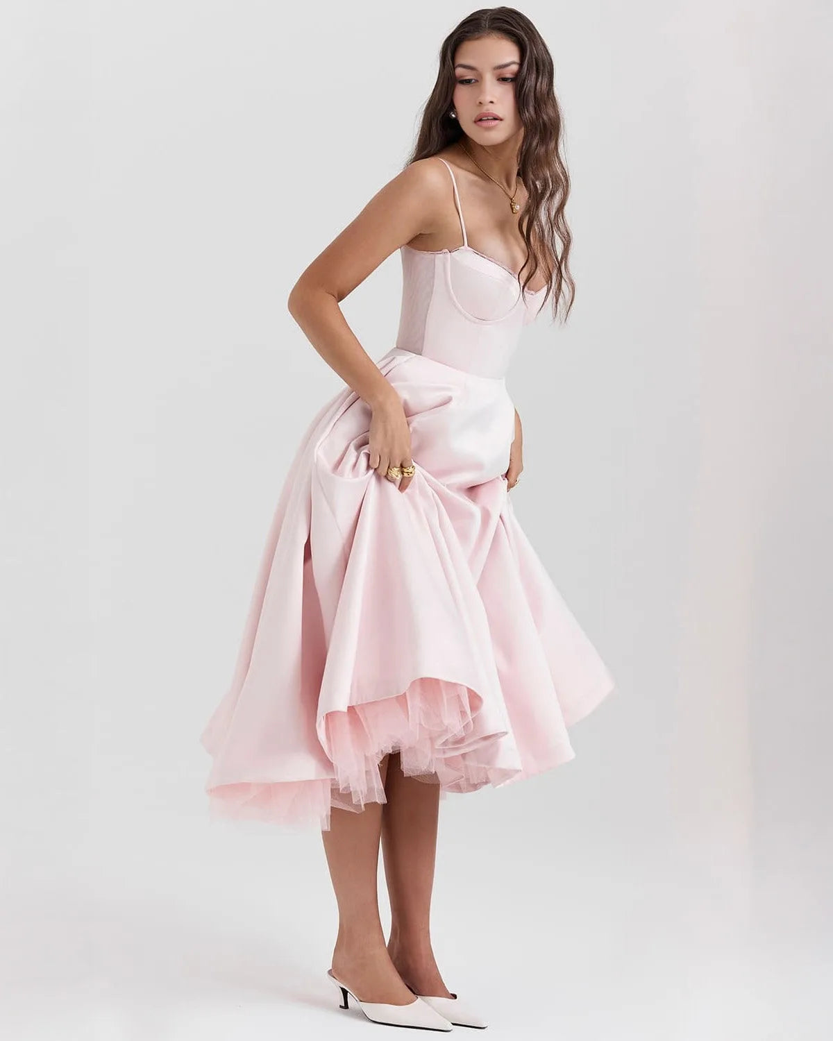 Women's sweetheart midi dress with fitted bodice and full skirt, pink, lifting the skirt