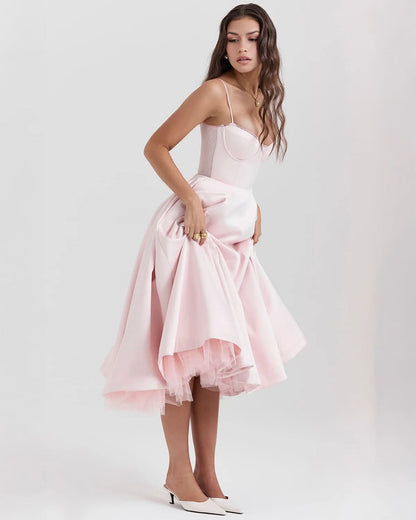 Women's sweetheart midi dress with fitted bodice and full skirt, pink, lifting the skirt