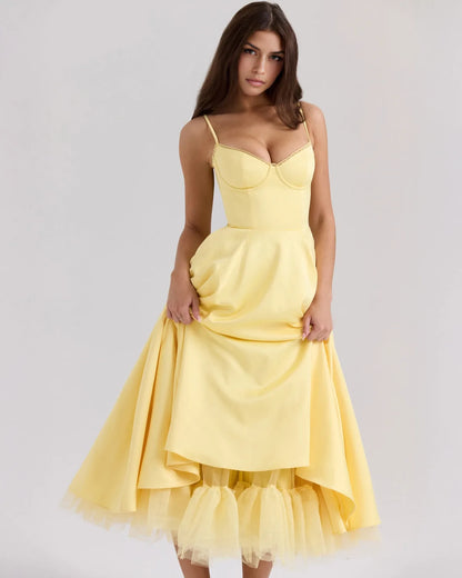 Women's sweetheart midi dress with fitted bodice and full skirt, yellow, lifting the skirt to show the inner layer
