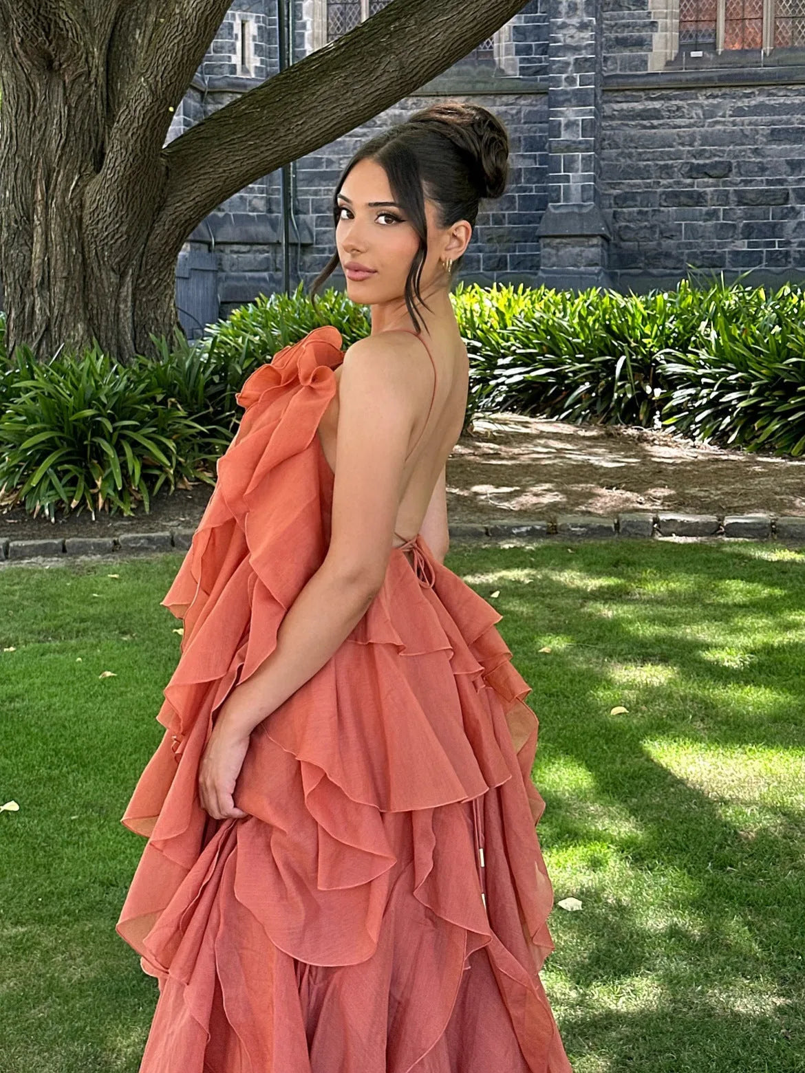 Women's tiered ruffle halter maxi dress, terracotta, back view outdoors
