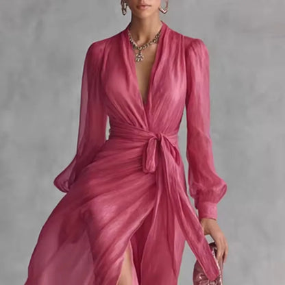 Women's pink V-neck wrap maxi dress with belt and slit, close-up of the V-neck and belt