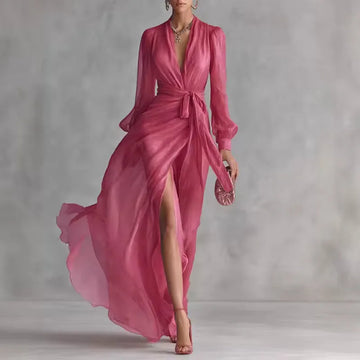 Women's pink V-neck wrap maxi dress with belt and slit, front view with slit