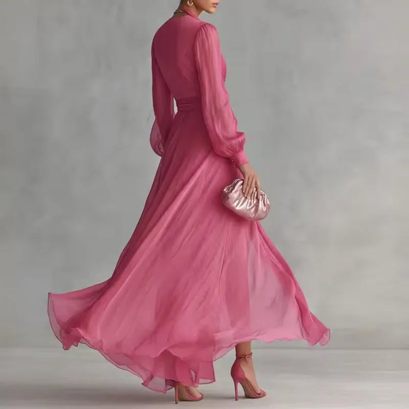 Women's pink V-neck wrap maxi dress with belt and slit, skirt in motion