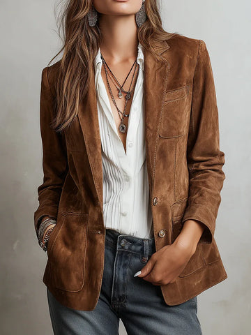 Women's brown vintage blazer with patch pockets, front view with white shirt and jeans