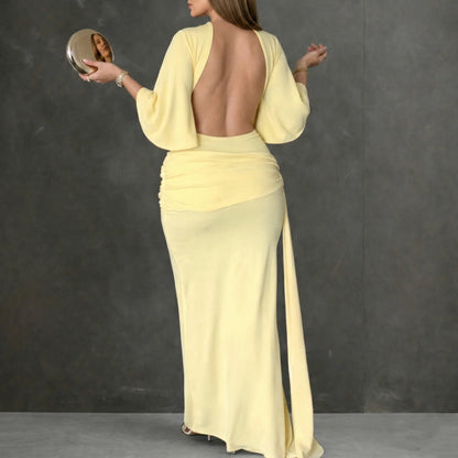 Women's yellow maxi dress with open back and high slit, back view with open back