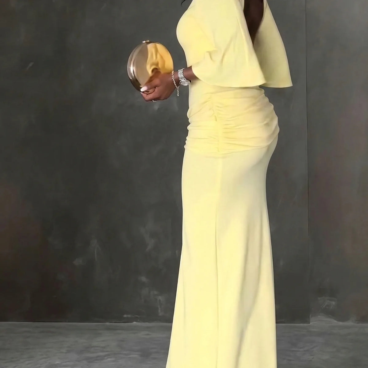 Women's yellow maxi dress with open back and high slit, back view