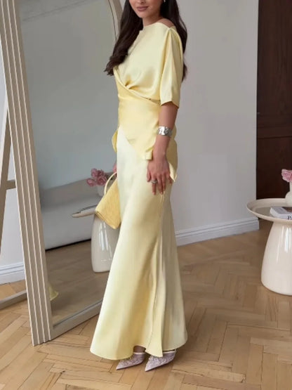 Women's yellow off-shoulder wrap top and long skirt set, side view