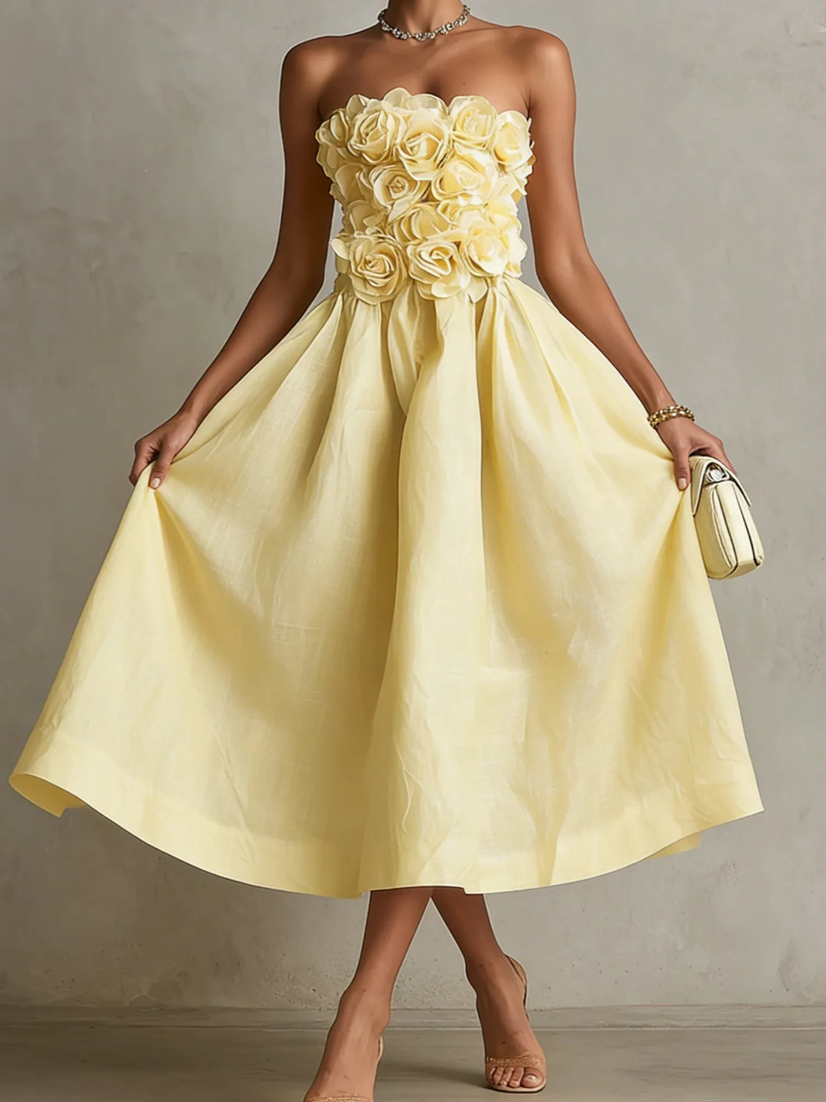 Women's yellow strapless midi dress with 3D flower bodice, front view lifting the skirt