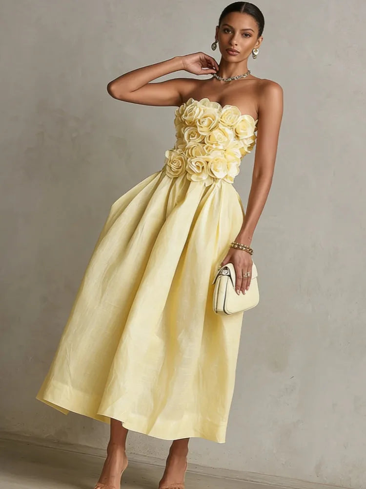 Women's yellow strapless midi dress with 3D flower bodice, three-quarter view